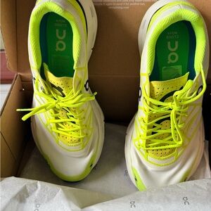 On Running White and Neon Yellow Athletic Shoes